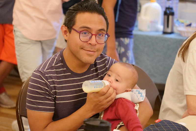 Dad feeding his baby