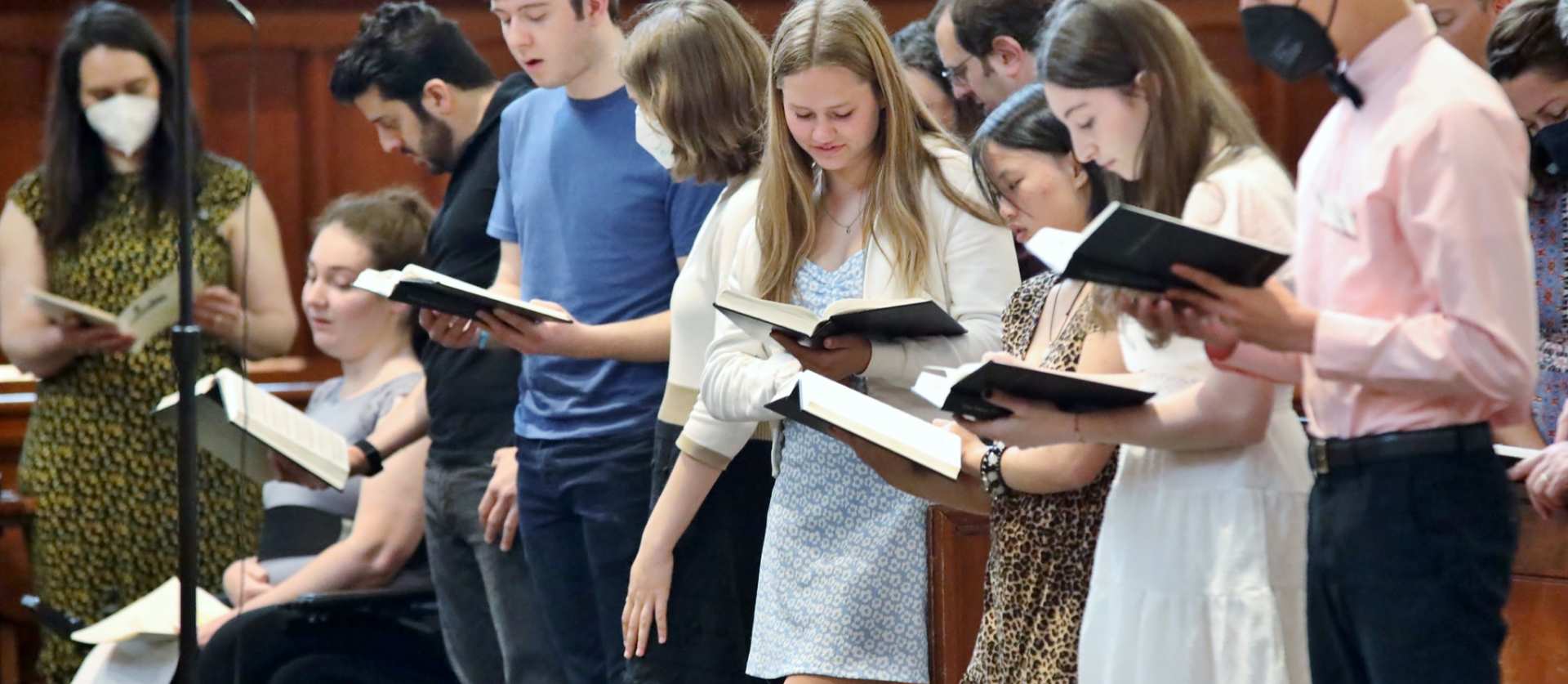 Youth Group members sing a hymn during worship