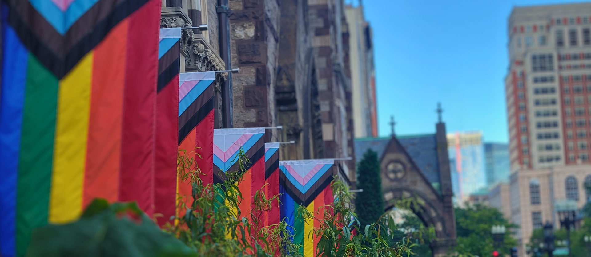 Progress pride flags outside of Old South Church in Boston