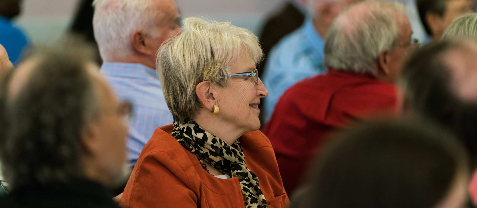 A member listening during an All-Church event in Mary Norton Hall